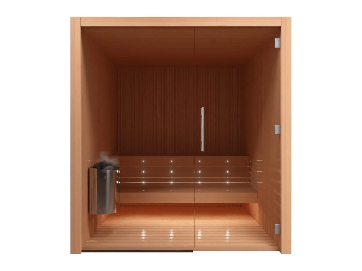 Auroom Libera Glass indoor sauna in alder with a full glass front and lit two-level benches, front view
